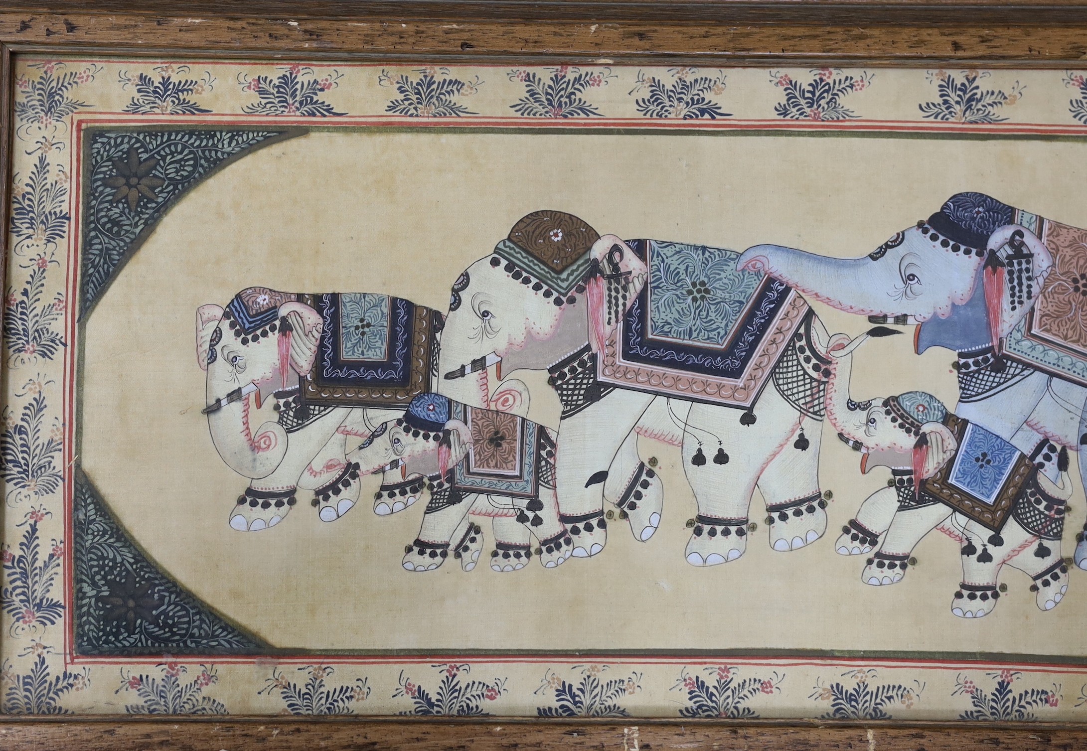 An Indian watercolour on silk, elephants, framed.